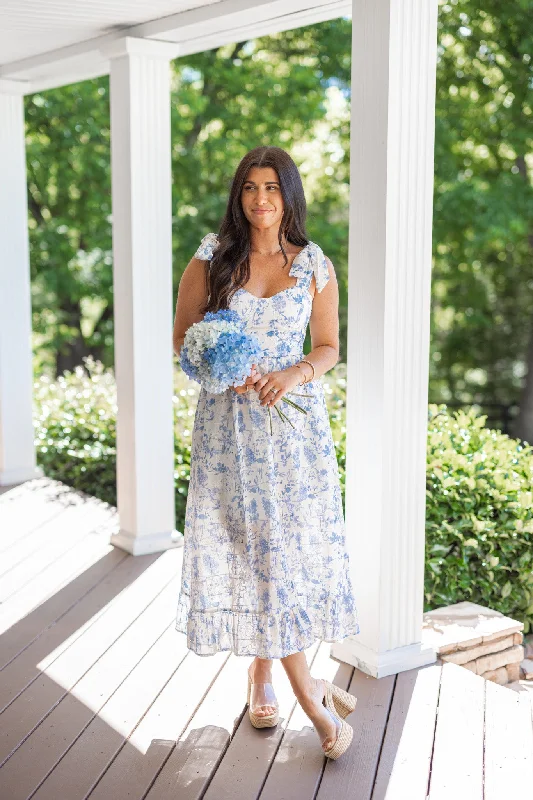 Dress to impress with elegant women’s wear   Summer Florals Cream Midi Dress