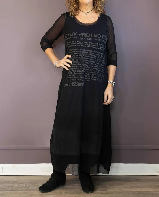 Trendy women’s clothing with a modern twist Sheer Sleeve Graphic Maxi Dress In Black Trendy women’s clothing with a modern twist Sheer Sleeve Graphic Maxi Dress In Black