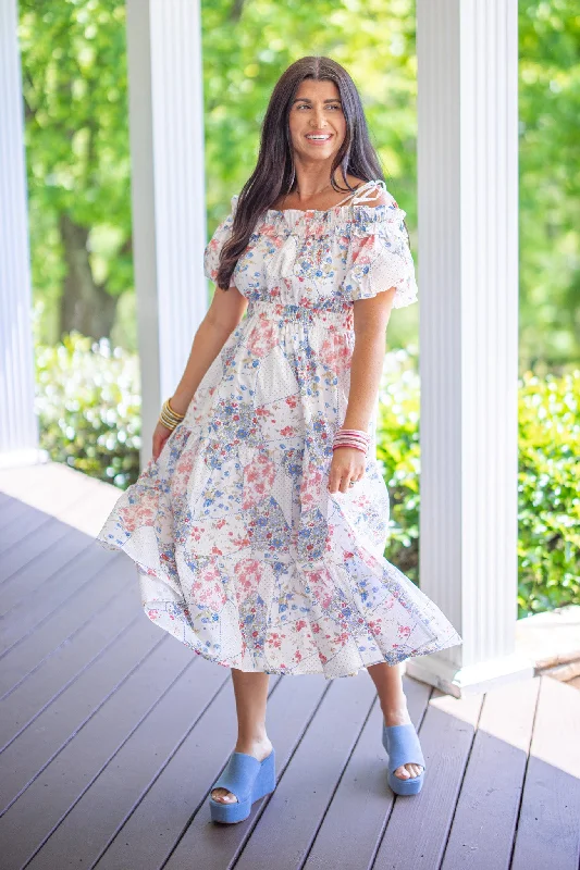 Step into style with our women’s clothing collection   Floral Patchwork Ivory Midi Dress