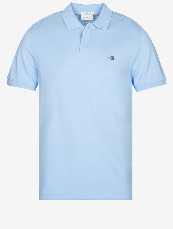 Shop now for fresh styles at discounted prices.  Regular Shield Short Sleeve Pique Polo Capri Blue